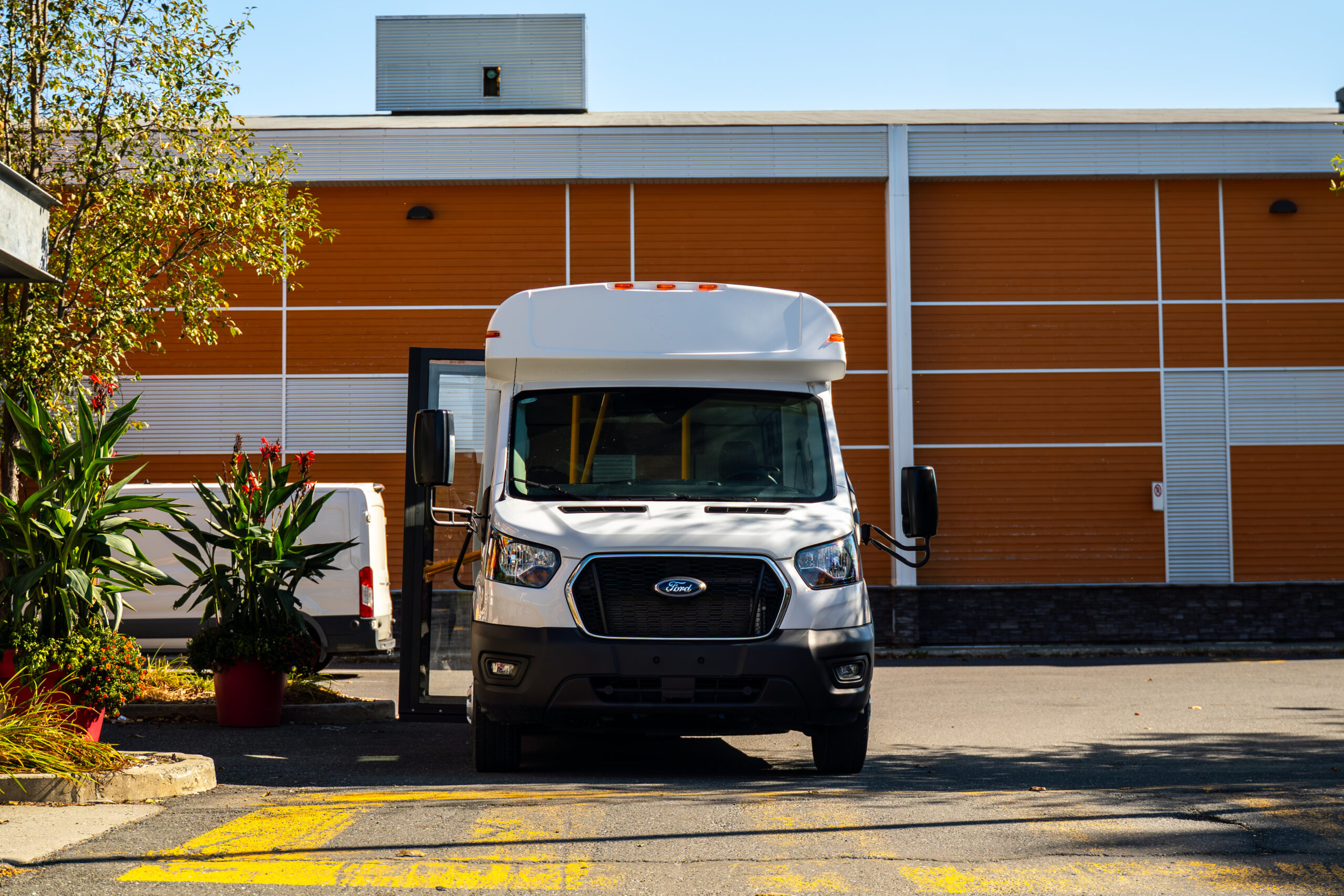 Micro Bird CT-Series commercial bus parked in front of a transit facility